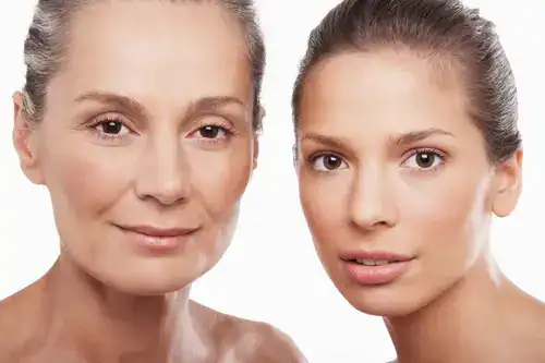 Two woman smiling towards camera